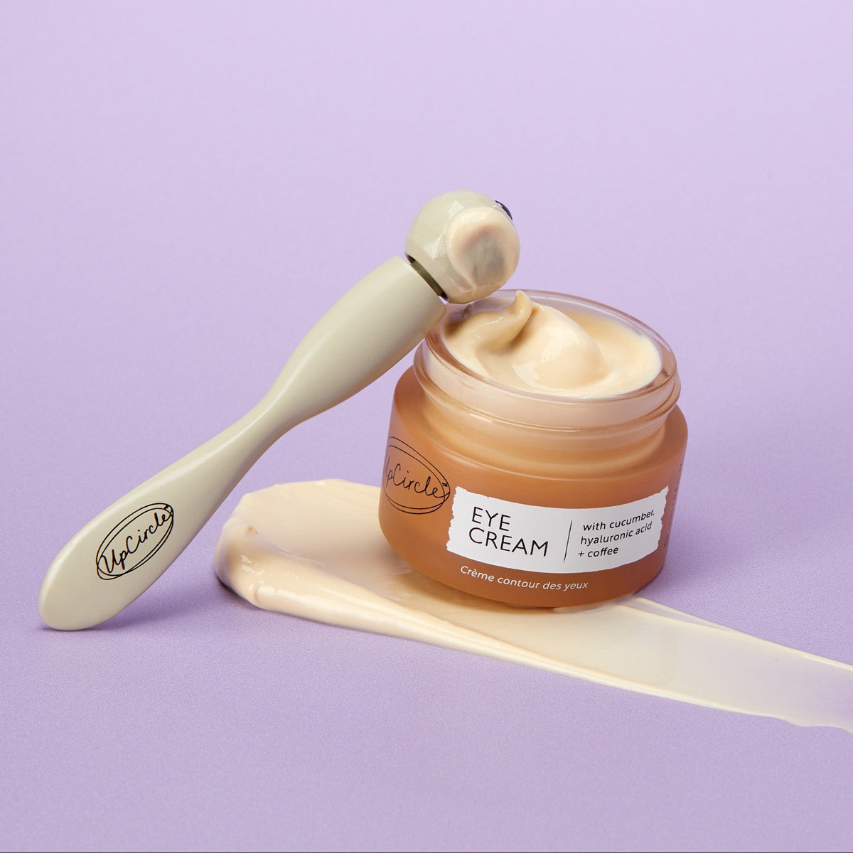 Eye cream UpCircle Merry + Bright Eyes Gift Set with tan jar and spoon lavender backdrop on Tampa Home & Garden Store