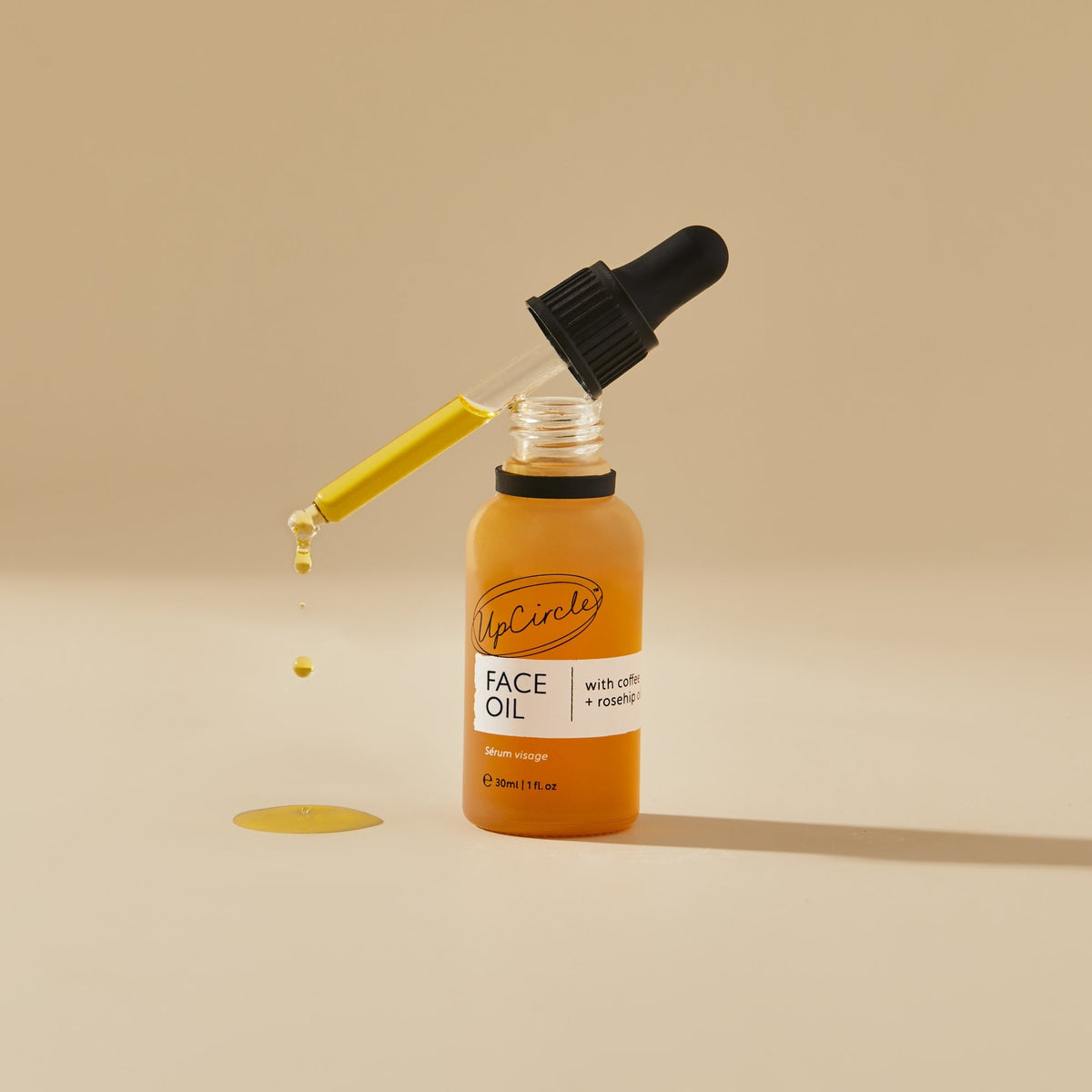 Face oil UpCircle The Caffeinated Duo bottle with dropper and yellow oil on Tampa Home & Garden Store