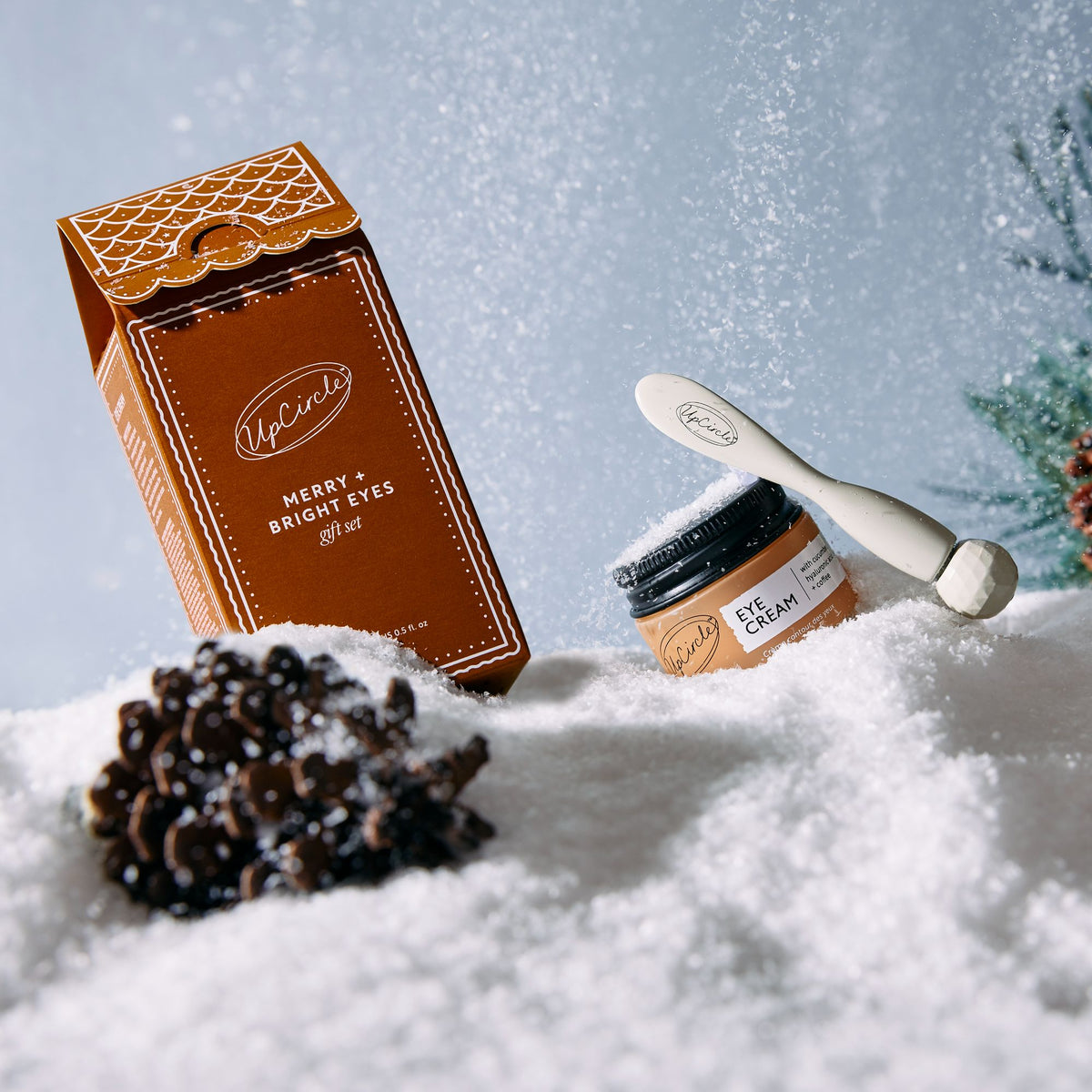 Merry + Bright Eyes Gift Set by UpCircle in orange box with eye cream on snowy surface on Tampa Home & Garden Store