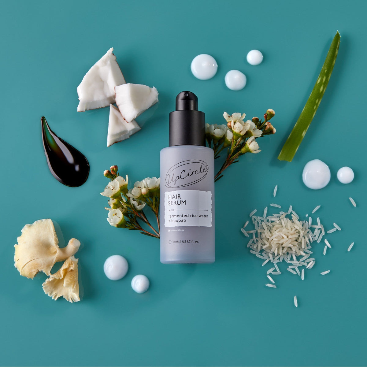 Hair Serum UpCircle bottle with black pump on teal bg fermented rice water + baobab on Tampa Home & Garden Store