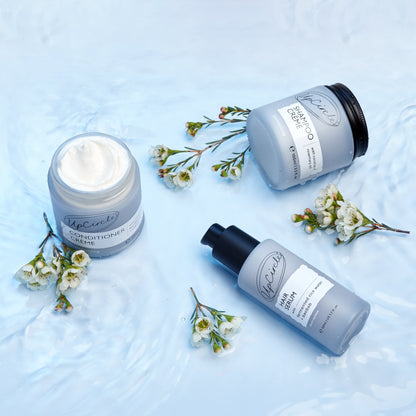UpCircle Haircare: gray shampoo, conditioner creme, hair serum bottle on blue background on Tampa Home & Garden Store
