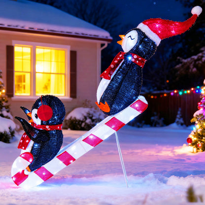 Lighted penguin Christmas decoration duo on candy cane pole with red scarf and 170 LEDs on Tampa Home & Garden Store