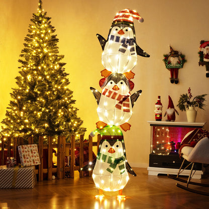 Lighted penguin stack decoration with warm white LEDs, scarves and hats on Tampa Home & Garden Store