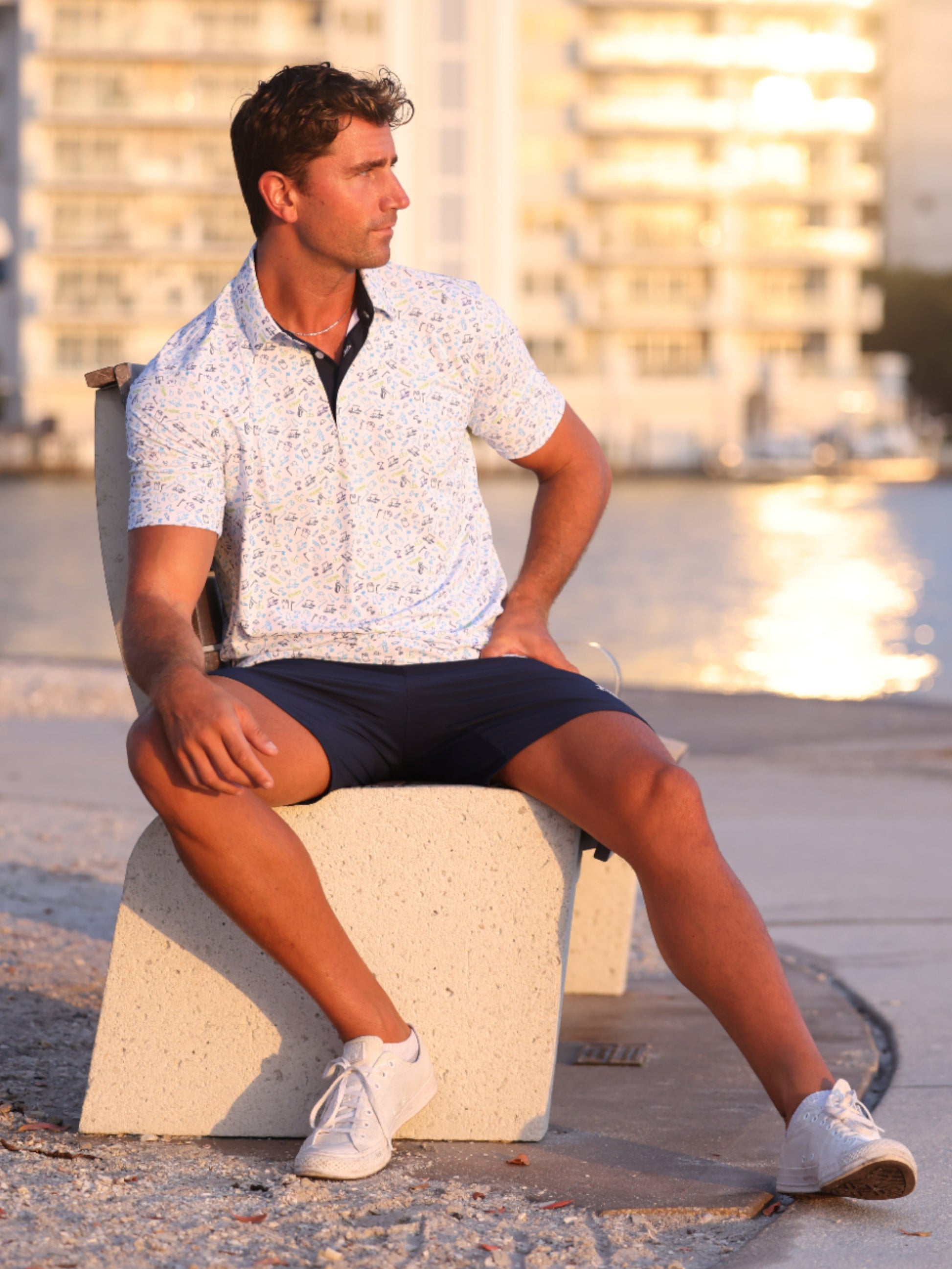 Links Print Polo by White Water Life, white short-sleeve polo with blue link pattern on Tampa Home & Garden Store