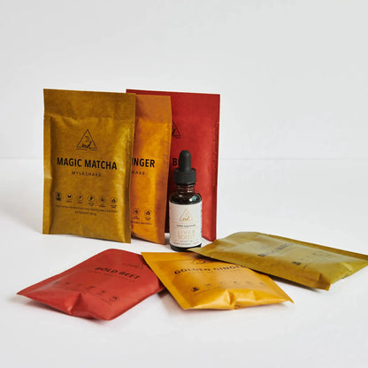 Liver Boost herbal supplement bottle with OWL Venice logo, gold and red pouches in view on Tampa Home & Garden Store