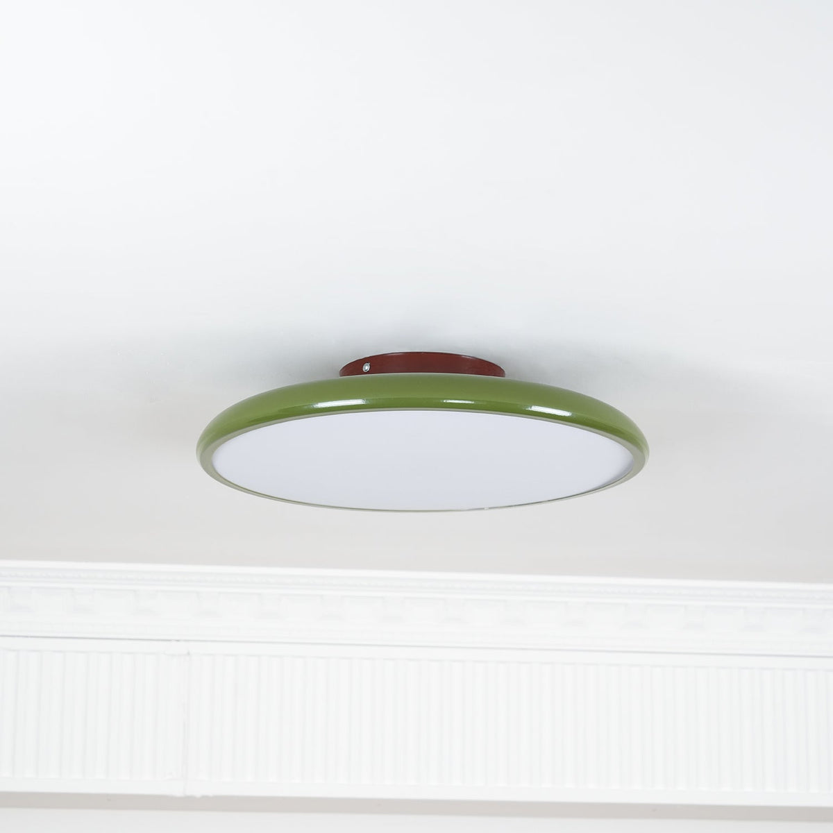 Orbitra green round flush-mount LED ceiling light with white diffuser and red mounting base on Tampa Home & Garden Store