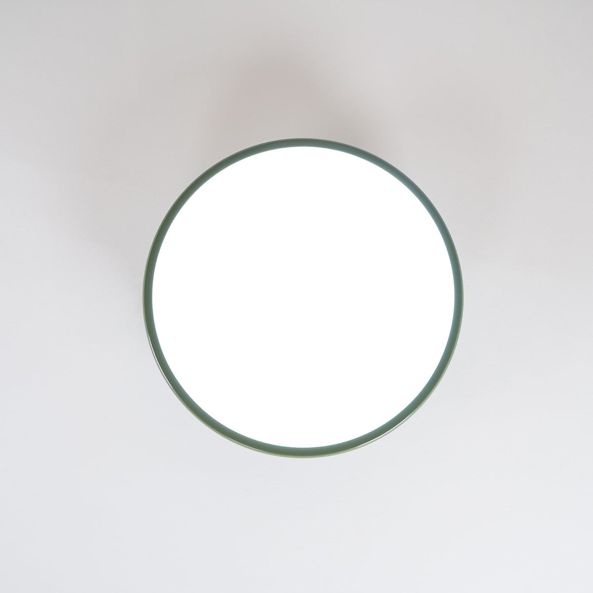 Orbitra round flush mount LED ceiling light with green frame on Tampa Home & Garden Store