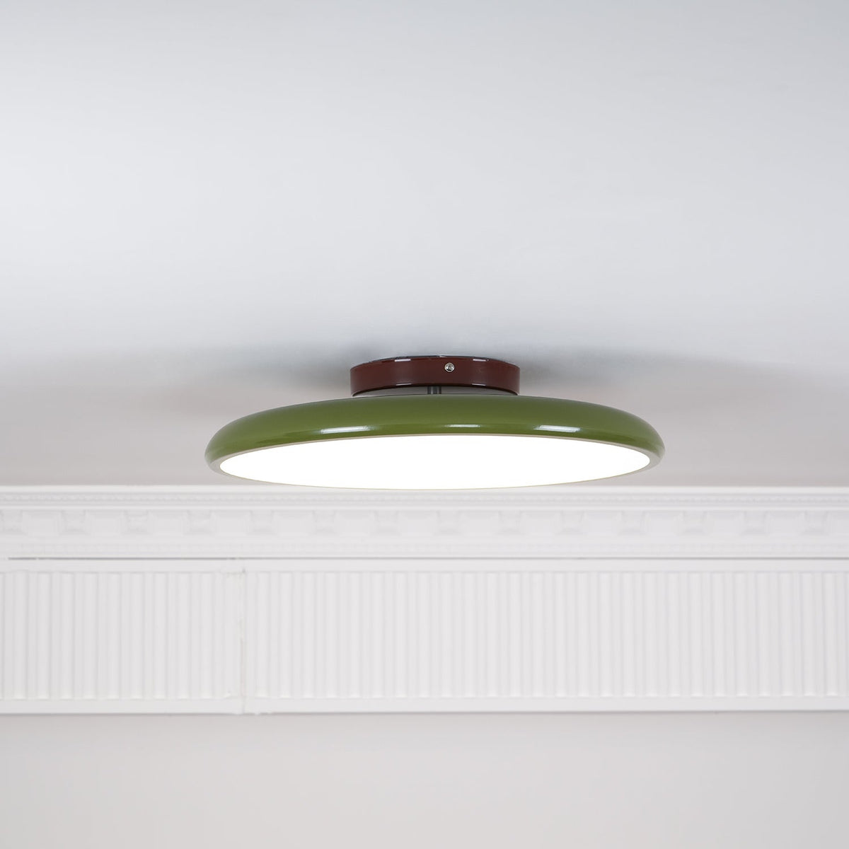 Orbitra flush mount LED ceiling light with swivel arm, green ring, brown canopy, dimmable on Tampa Home & Garden Store