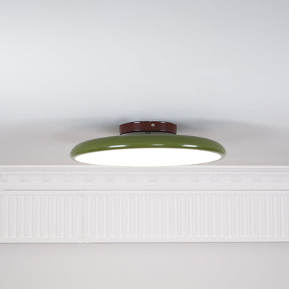 Orbitra flush mount LED ceiling light with swivel arm, green ring, brown canopy, dimmable on Tampa Home & Garden Store
