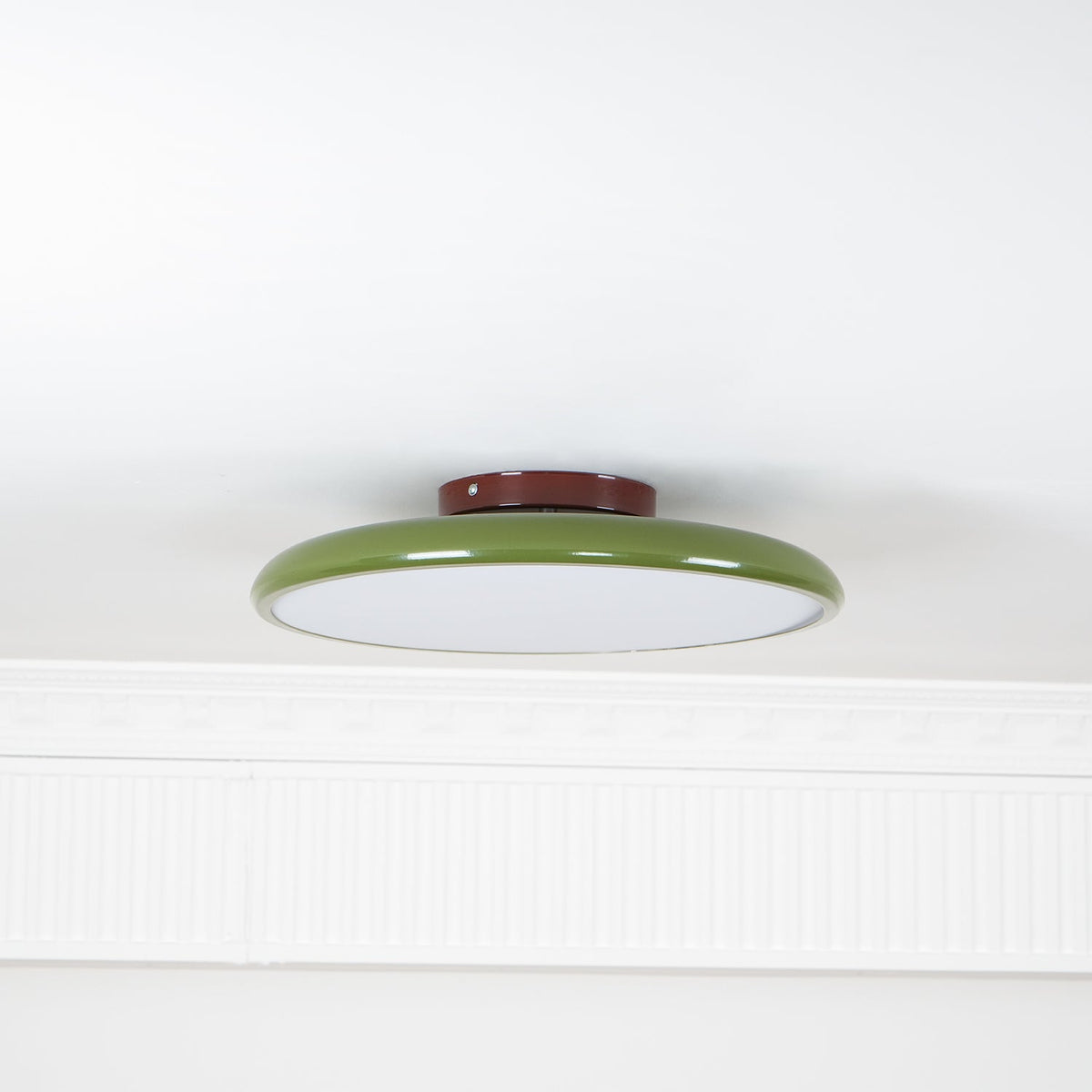 Orbitra flush mount LED ceiling light with green ring and brown base, white diffuser on Tampa Home & Garden Store