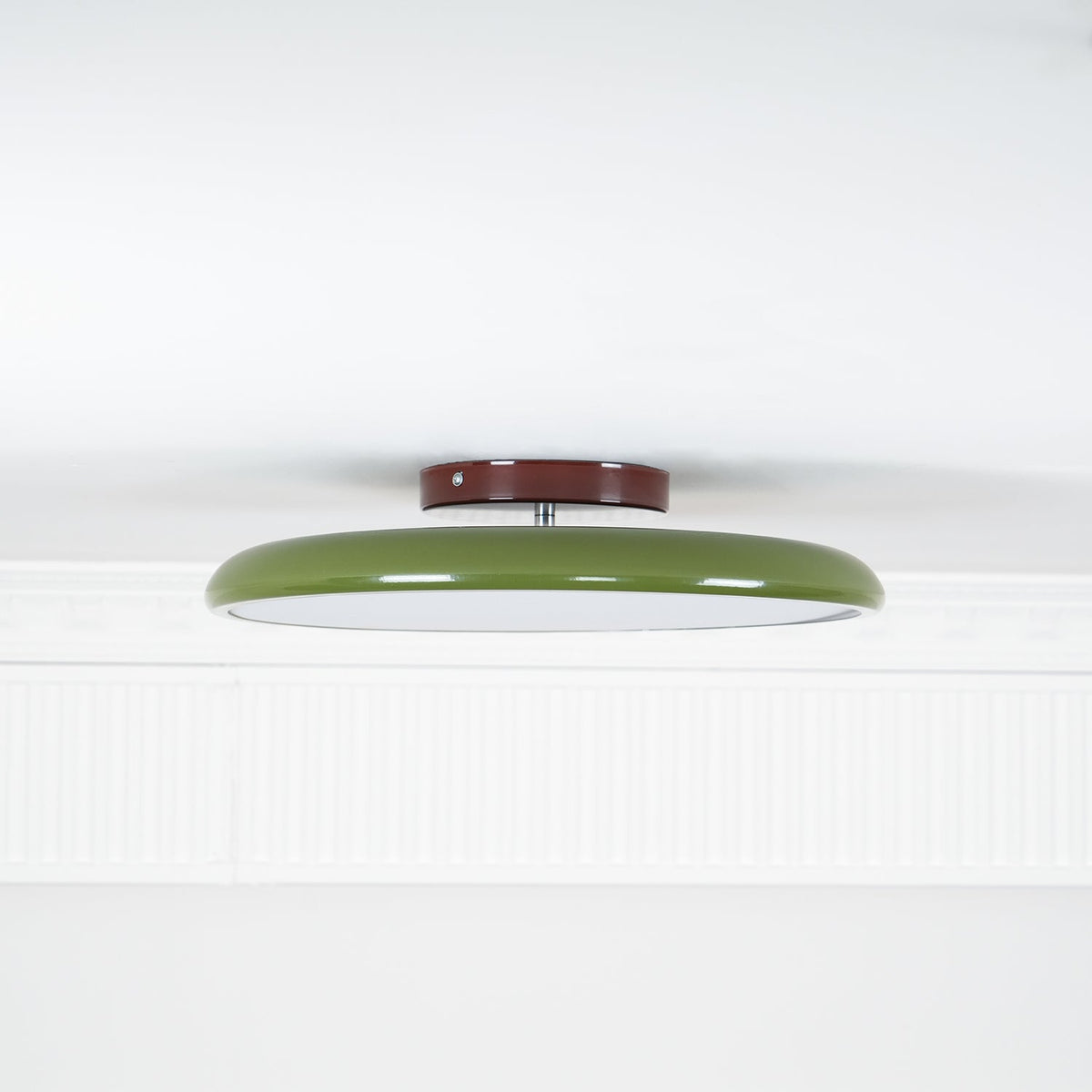 Orbitra flush mount LED ceiling light with swivel arm, green ring and brown canopy on Tampa Home & Garden Store