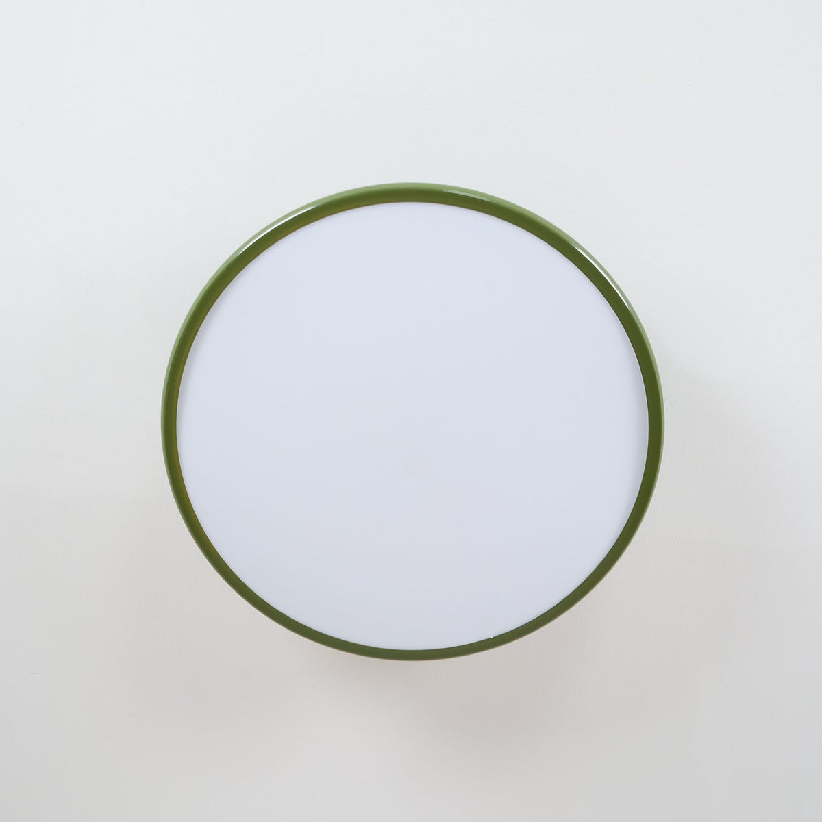 Orbitra round flush mount LED ceiling light with green frame and white diffuser on Tampa Home & Garden Store