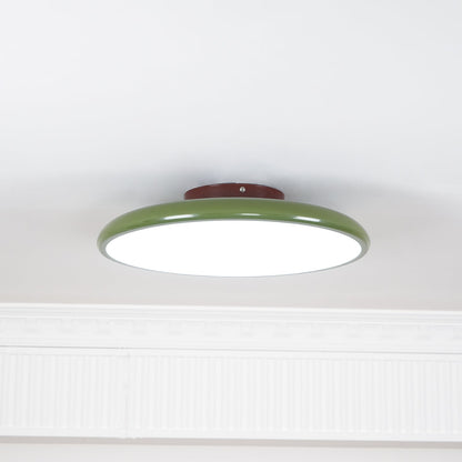 Orbitra flush mount LED ceiling light with green circular frame and white diffuser on Tampa Home & Garden Store