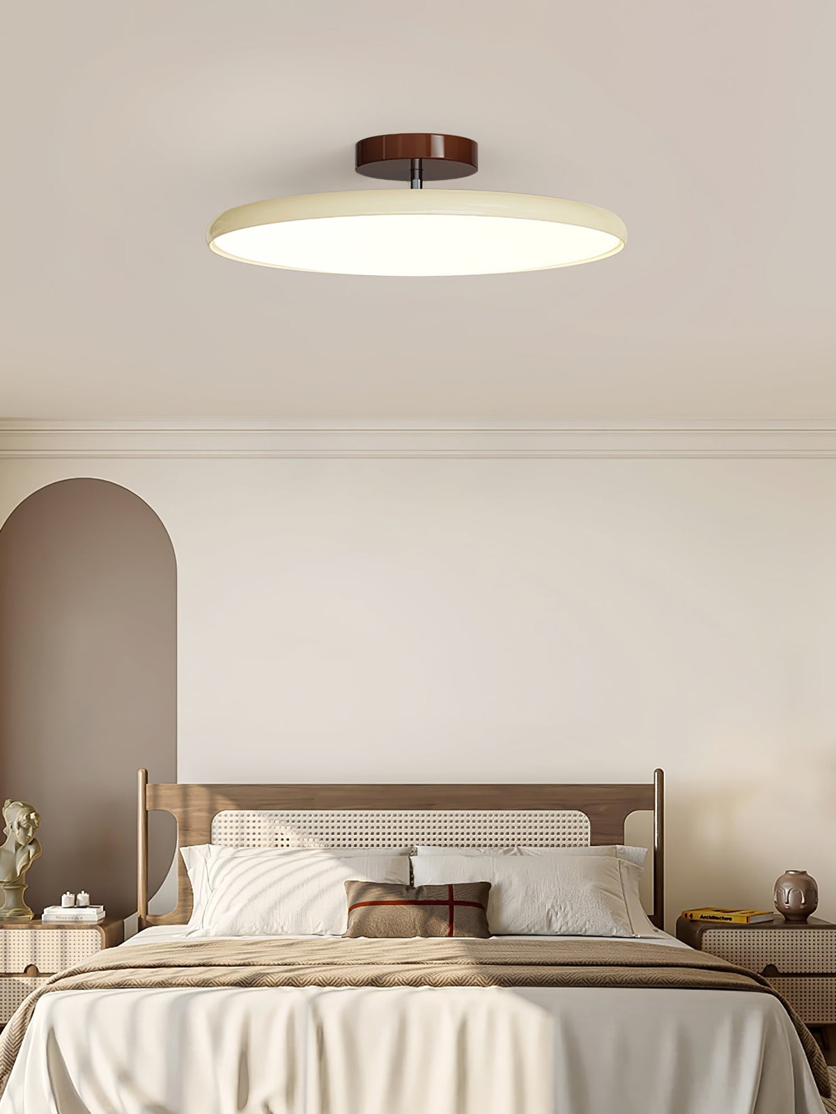 Orbitra flush mount LED ceiling light with swivel arm in beige finish above a bed on Tampa Home & Garden Store