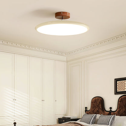 Orbitra flush mount LED ceiling light with beige circular shade and bronze canopy on Tampa Home & Garden Store