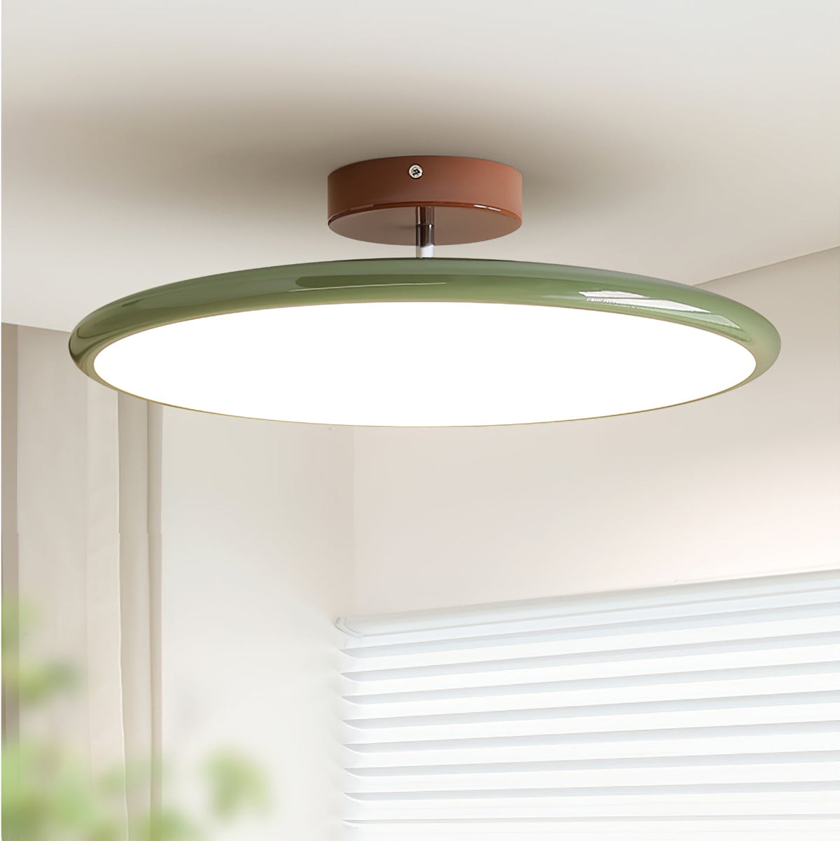 Orbitra green circular LED flush mount ceiling light with brown canopy and swivel arm on Tampa Home & Garden Store