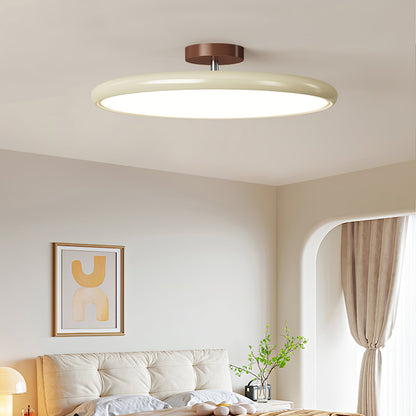 Orbitra flush-mount LED ceiling light with swivel arm; beige ring, brown canopy, dimmable on Tampa Home & Garden Store