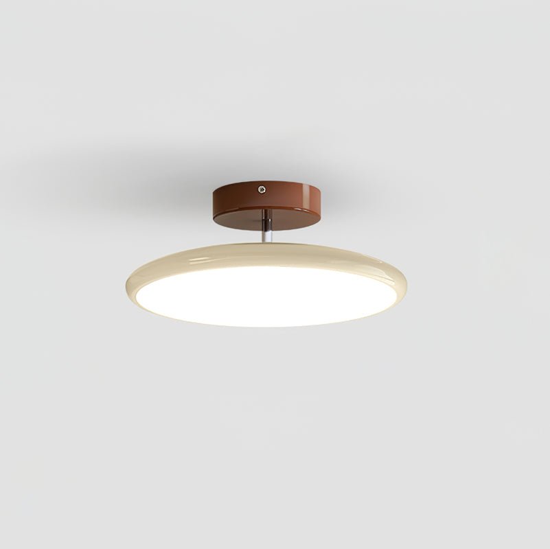 Orbitra flush mount LED ceiling light with swivel arm in beige ring and bronze mount on Tampa Home & Garden Store