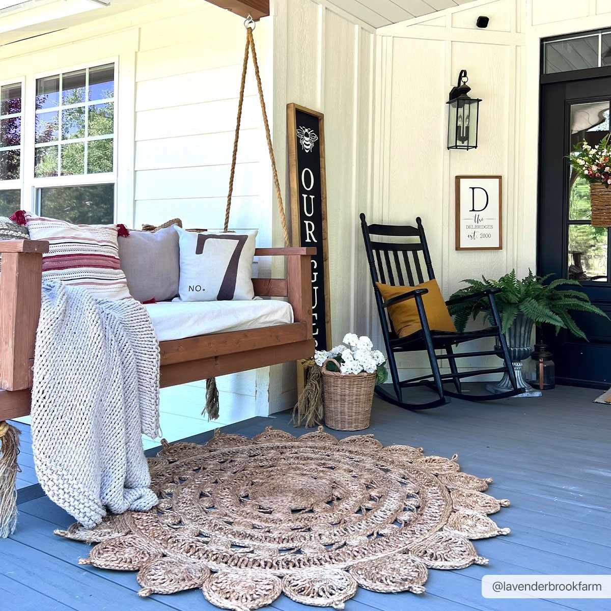 Longville round jute rug by Boutique Rugs in natural beige with crochet edge on a porch on Tampa Home & Garden Store