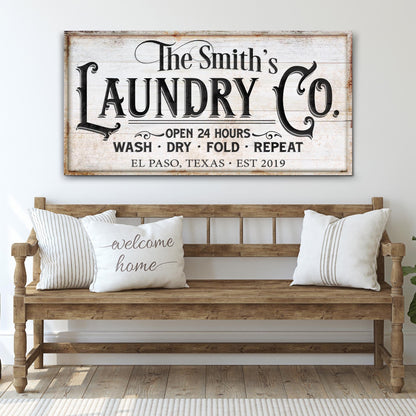 Canvas sign The Smith's Laundry Co with whitewashed wood and vintage typography on Tampa Home & Garden Store