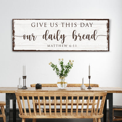 Canvas sign on white wood with text Give Us This Day our daily bread Matthew 6:11 on Tampa Home & Garden Store