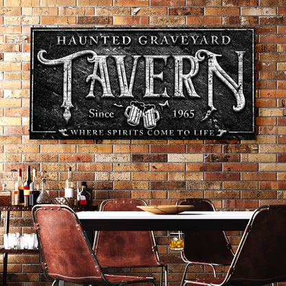 Haunted Graveyard Tavern canvas sign with black panel and white ornate lettering on Tampa Home & Garden Store