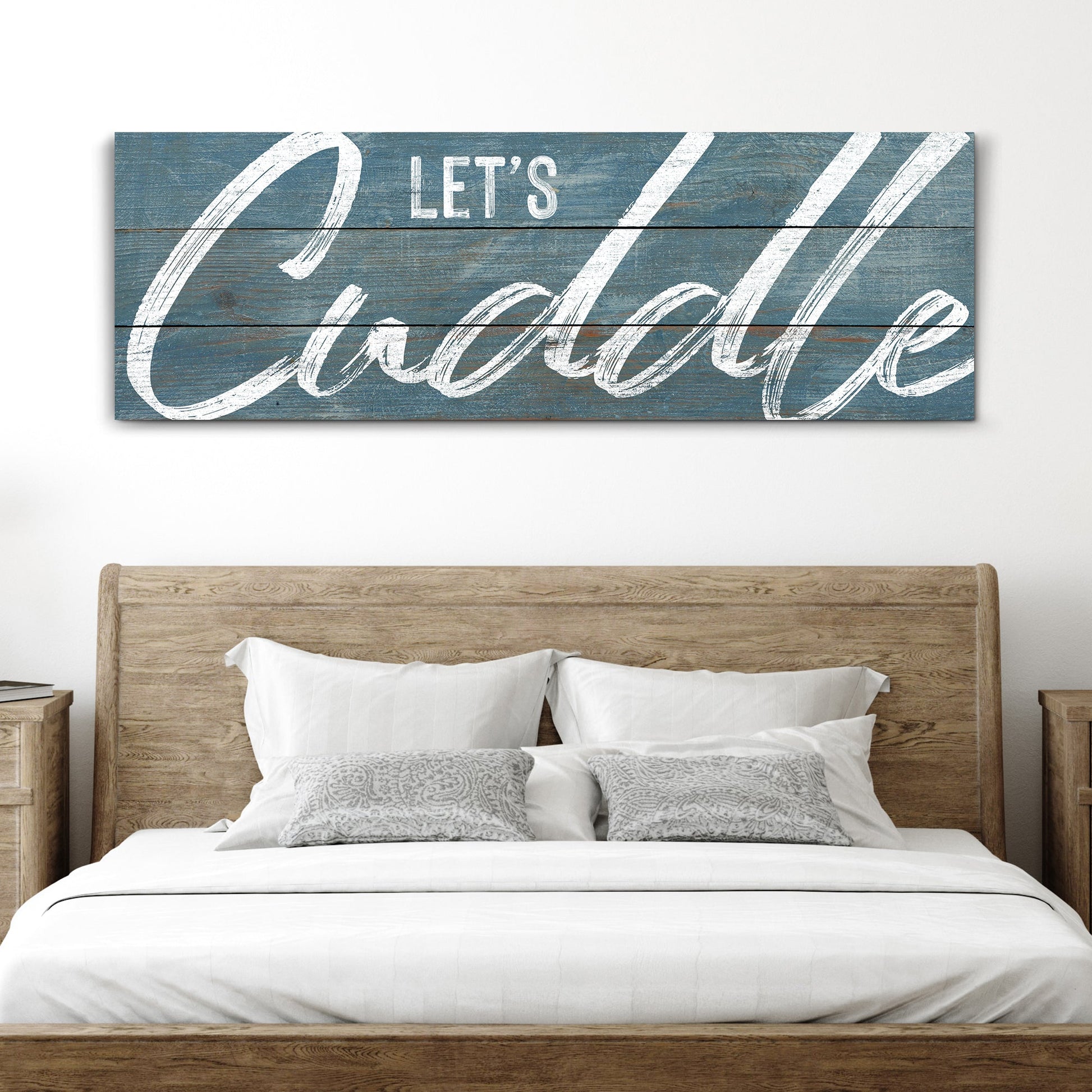 Let's Cuddle canvas sign from Tailored Canvases, blue distressed wood backdrop on Tampa Home & Garden Store
