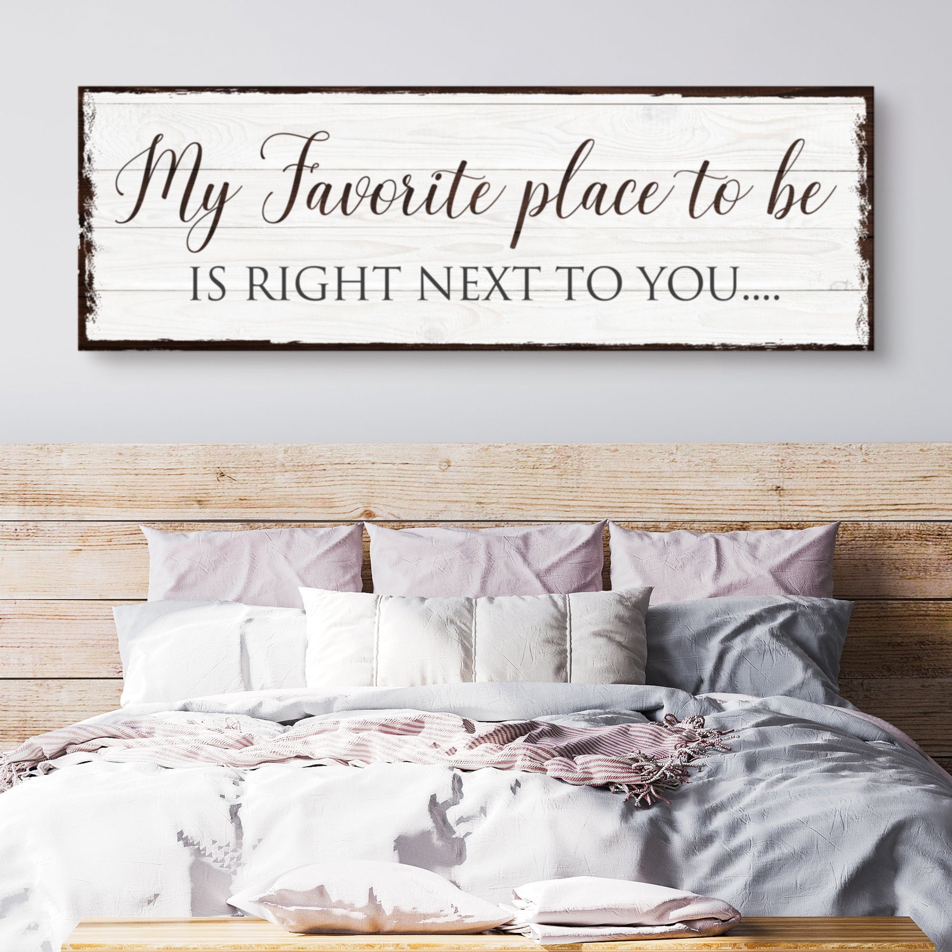 Canvas sign by Tailored Canvases with whitewashed wood planks and dark frame reading My Favorite place to be is Right Next to You on Tampa Home & Garden Store