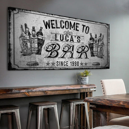 Bar sign canvas with vintage liquor bottles and Welcome to Luca's Bar lettering Tailored Canvases on Tampa Home & Garden Store