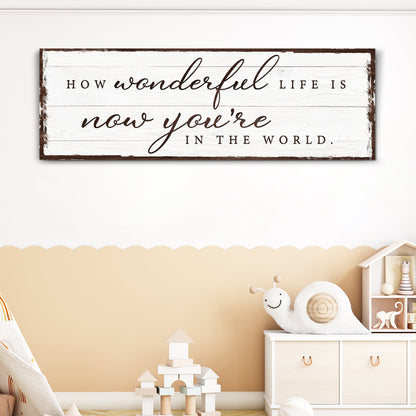 Canvas sign How Wonderful Life Is Now You're In The World Sign IV on white wood planks on Tampa Home & Garden Store