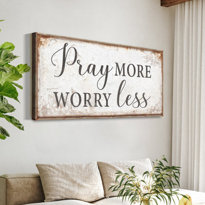 Rustic distressed white framed canvas sign reading Pray More Worry Less on Tampa Home & Garden Store