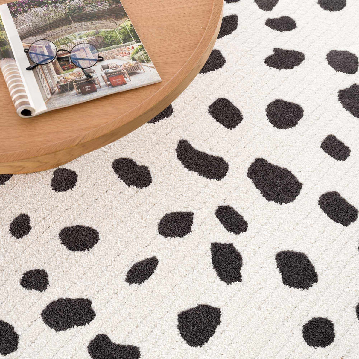 Tariffville Dalmatian Rug by Boutique Rugs cream background with black spots on Tampa Home & Garden Store