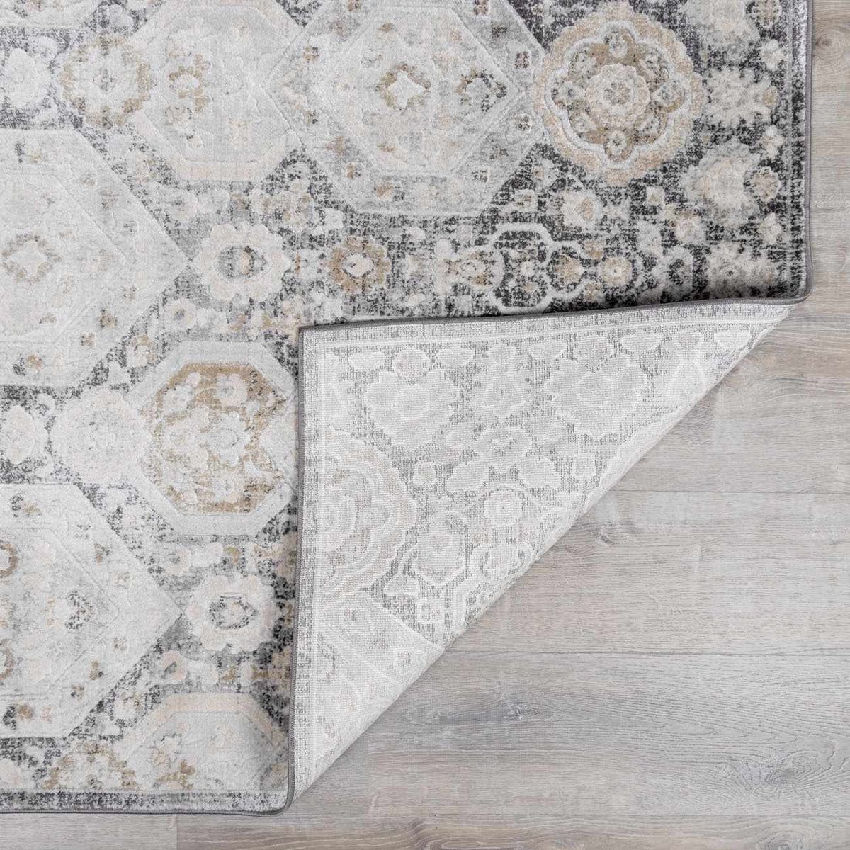 Minoa Area Rug by Boutique Rugs in ivory gray distressed medallion pattern on Tampa Home & Garden Store