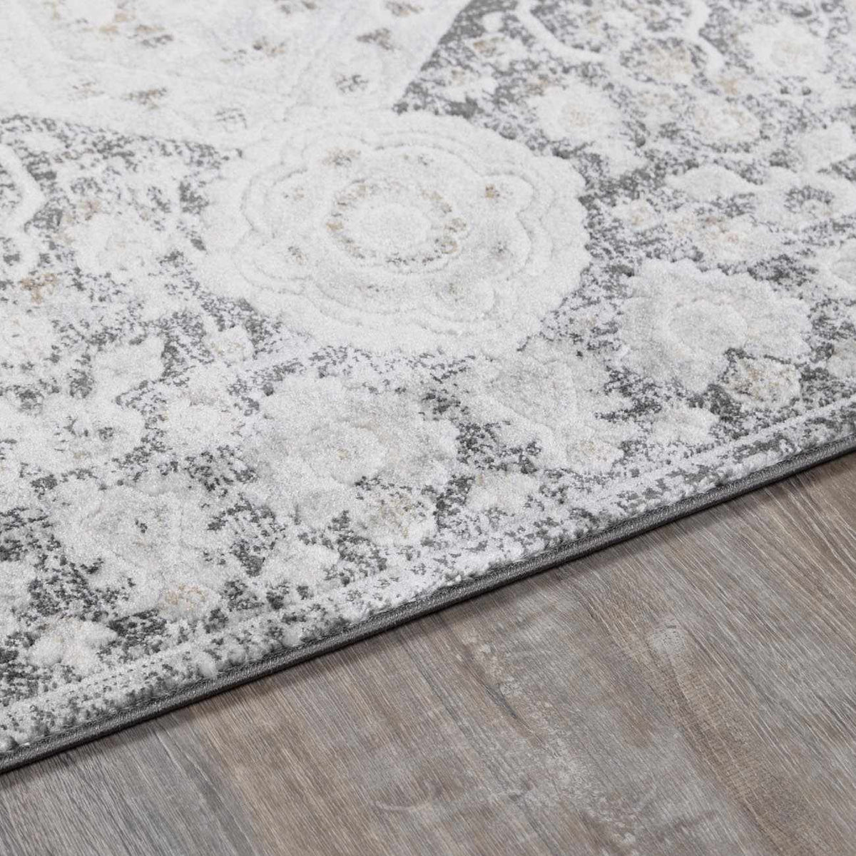 Minoa Area Rug by Boutique Rugs, ivory and gray distressed floral medallion design on Tampa Home & Garden Store