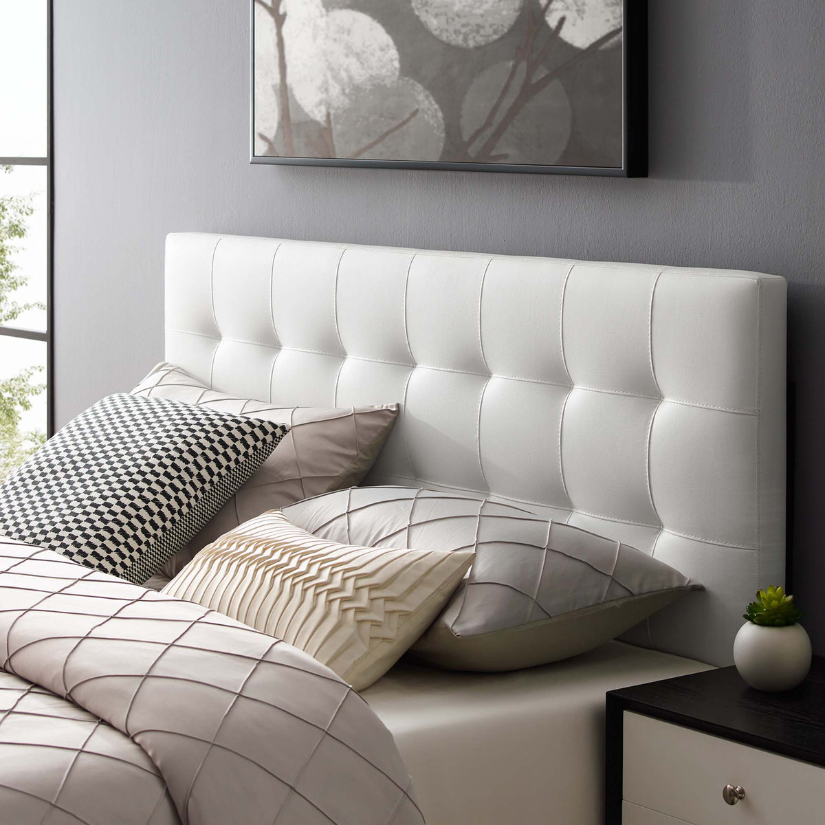 Lily Upholstered Vinyl King Headboard, white tufted headboard for king bed in a modern bedroom on Tampa Home & Garden Store