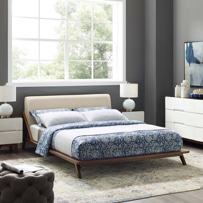 Luella upholstered queen platform bed with beige headboard and wood legs in grey bedroom on Tampa Home & Garden Store