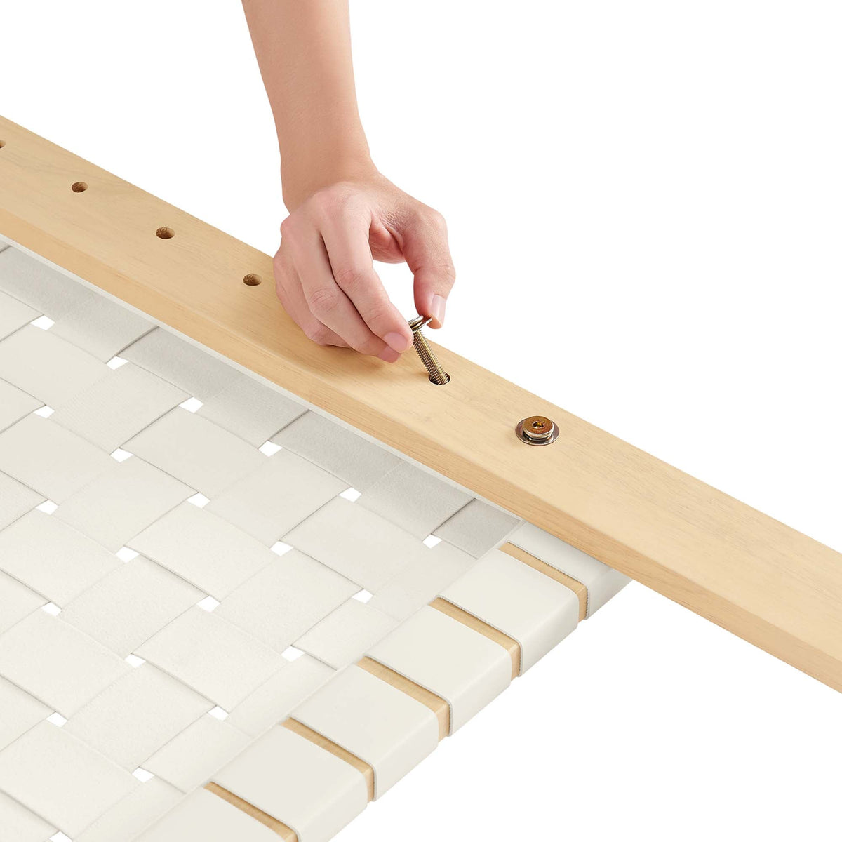 Sparta Weave vegan leather twin headboard being assembled on light wood frame with screws on Tampa Home & Garden Store
