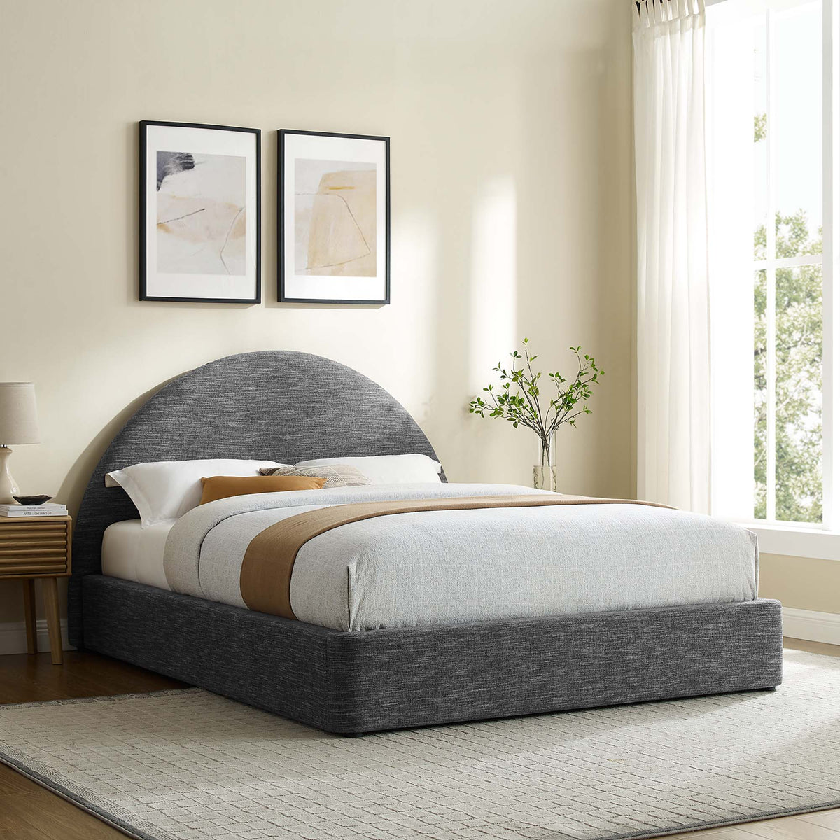 Resort upholstered fabric arched round platform bed in dark gray with neutral bedding on Tampa Home & Garden Store