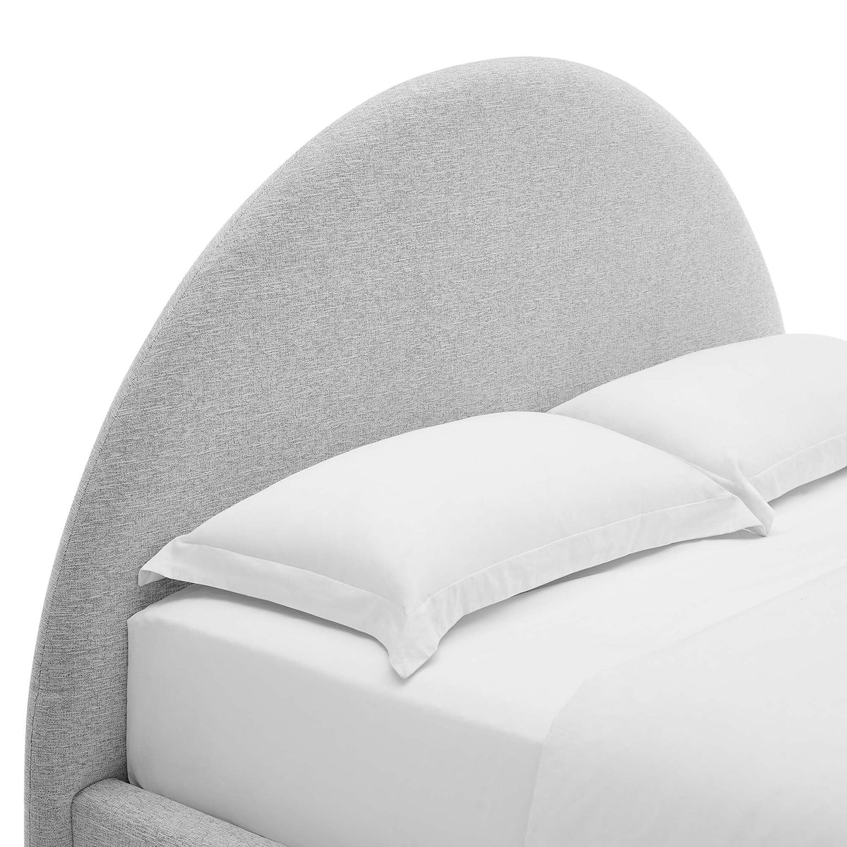 Resort upholstered fabric arched round platform bed gray headboard with white bedding on Tampa Home & Garden Store