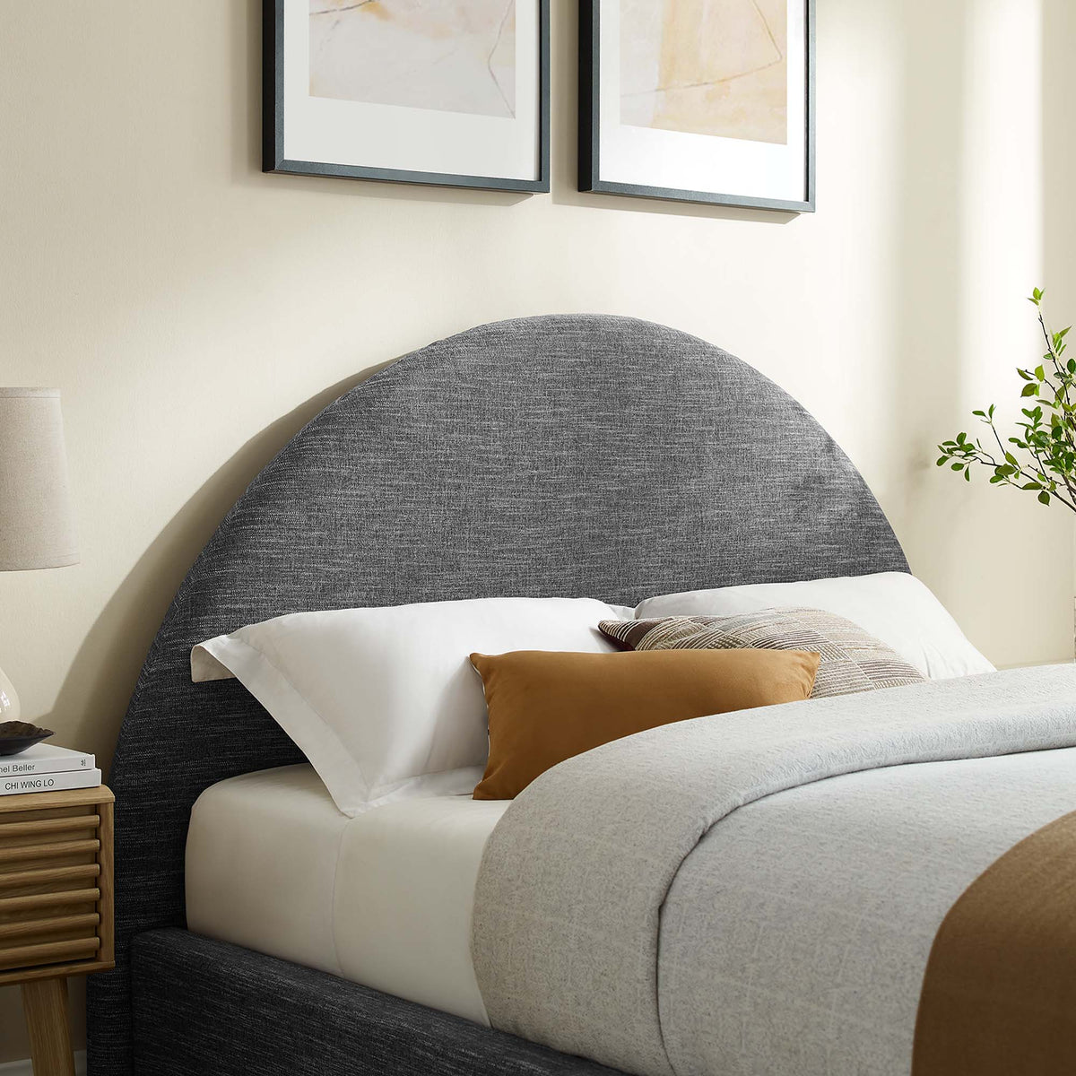 Resort upholstered fabric arched round platform bed in gray with white linens on Tampa Home & Garden Store