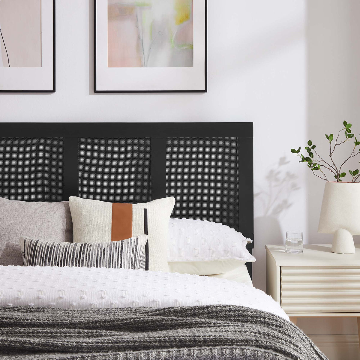 Sirocco platform bed with black textured headboard and white bedding in a modern bedroom on Tampa Home & Garden Store