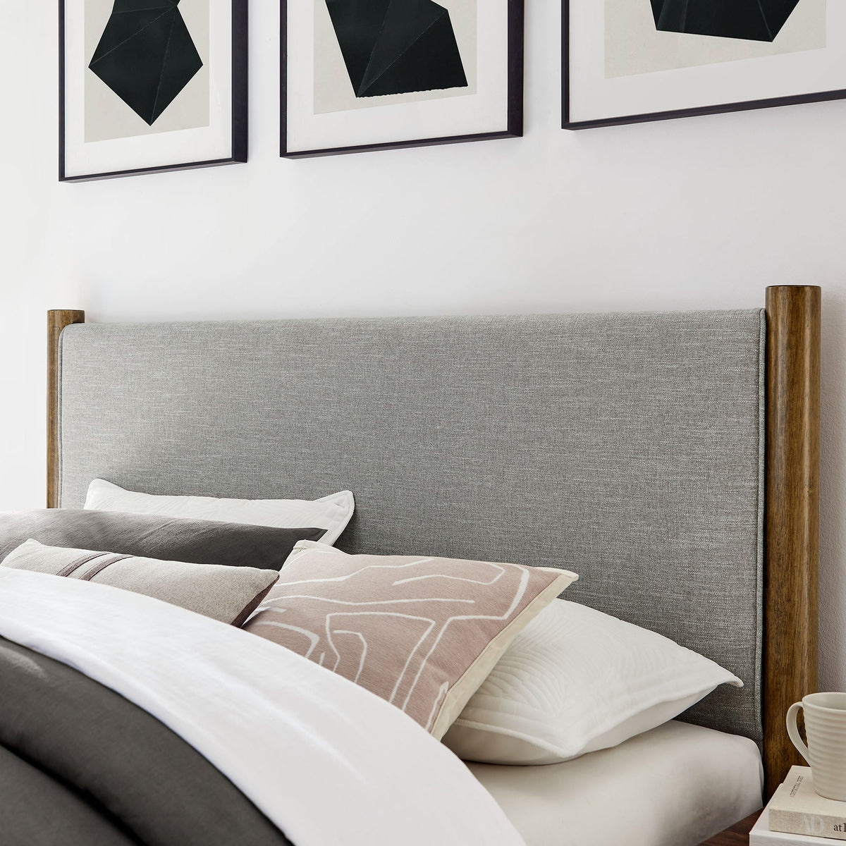 Maven fabric upholstered platform bed with gray headboard and wood posts in a modern bedroom on Tampa Home & Garden Store