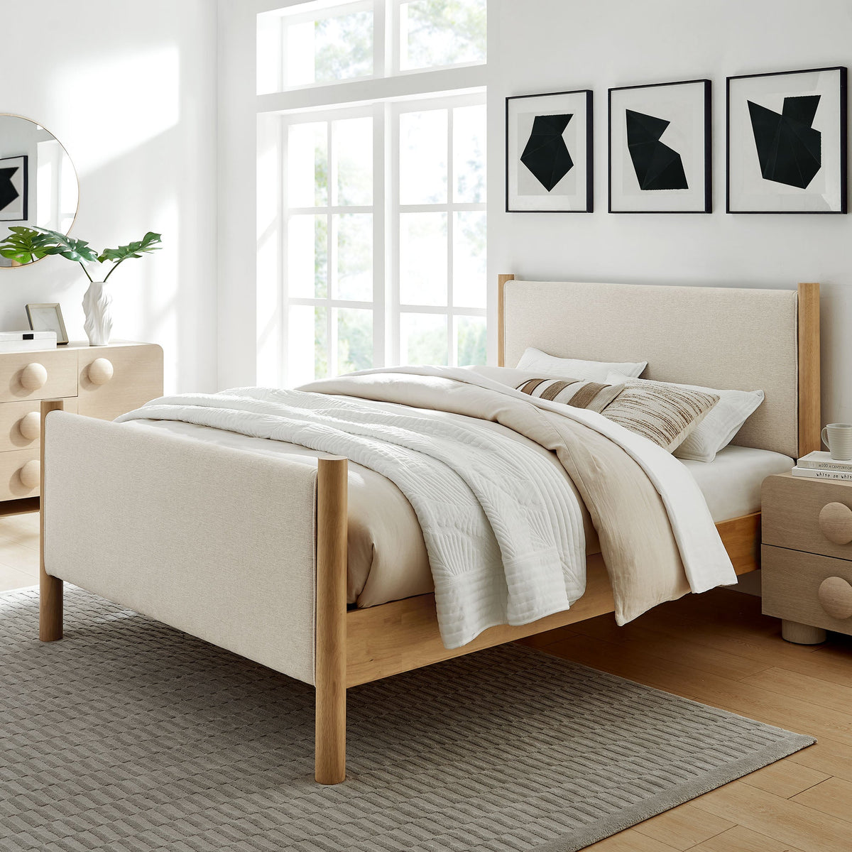 Maven Fabric Upholstered Platform Bed with beige fabric and light wood legs, geometric wall art on Tampa Home & Garden Store