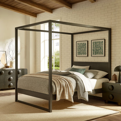Alva King canopy bed frame in dark metal with platform base and bedding against white brick wall on Tampa Home & Garden Store