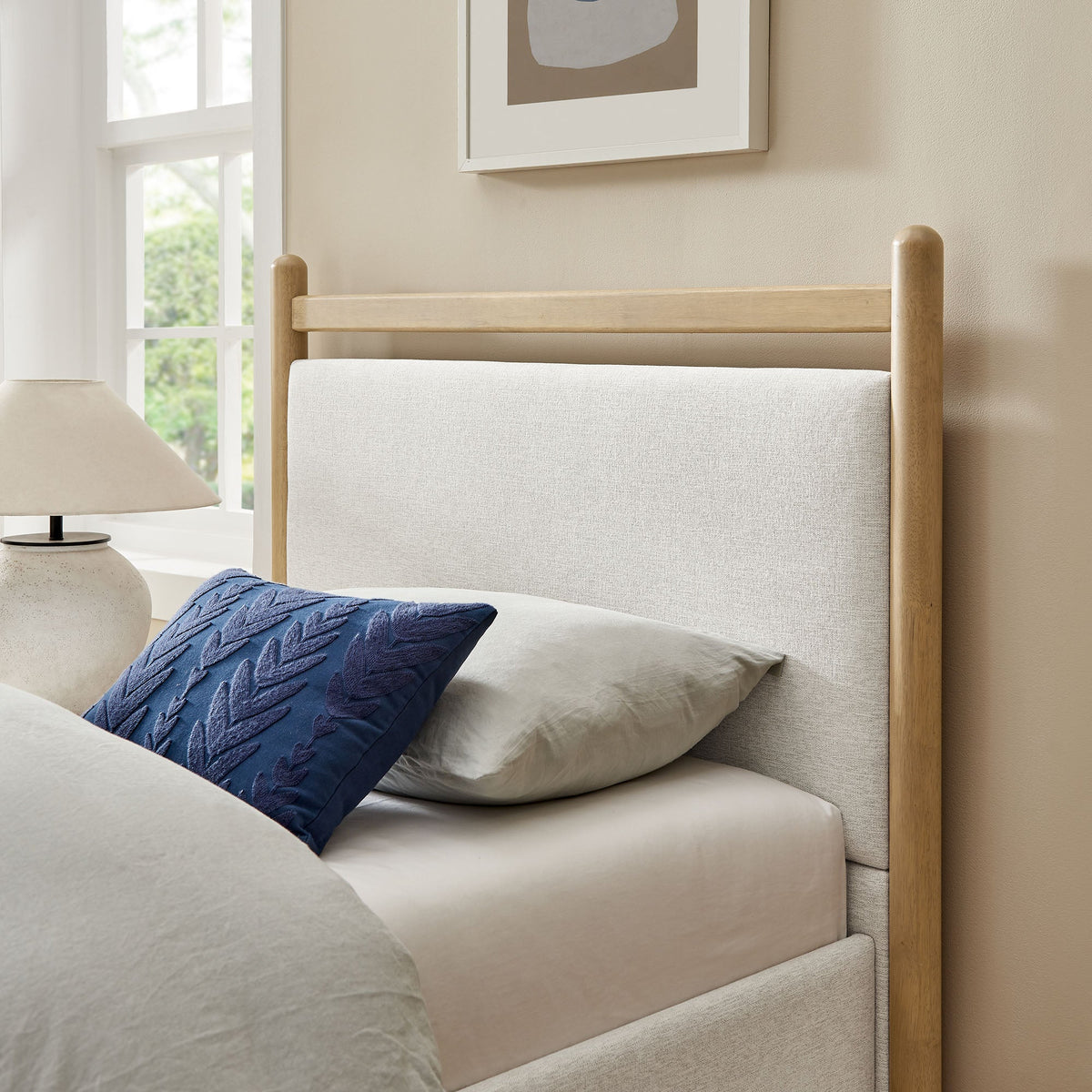 Ginny Platform Bed Frame beige natural wood posts blue pillow on Tampa Home & Garden Store