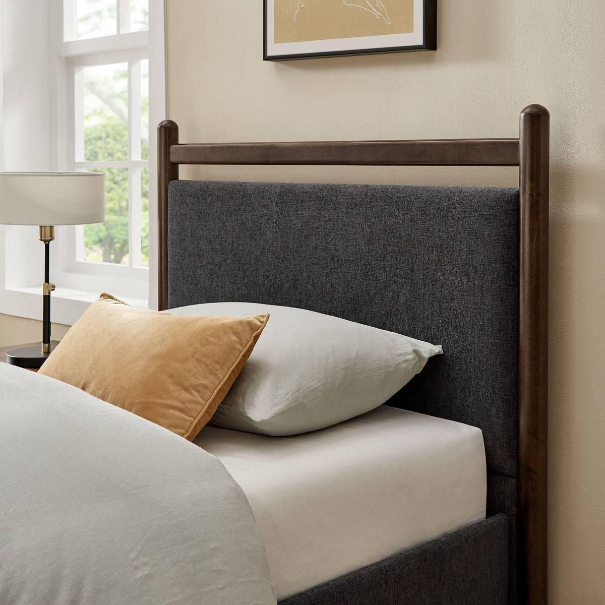 Ginny platform bed frame with dark wood finish and gray upholstered headboard on Tampa Home & Garden Store
