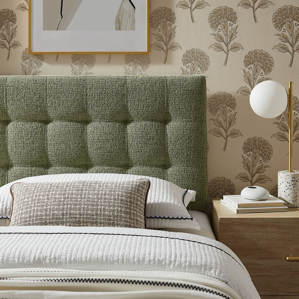 Lily Upholstered Headboard in moss-green fabric with white bedding and gold accents on Tampa Home & Garden Store