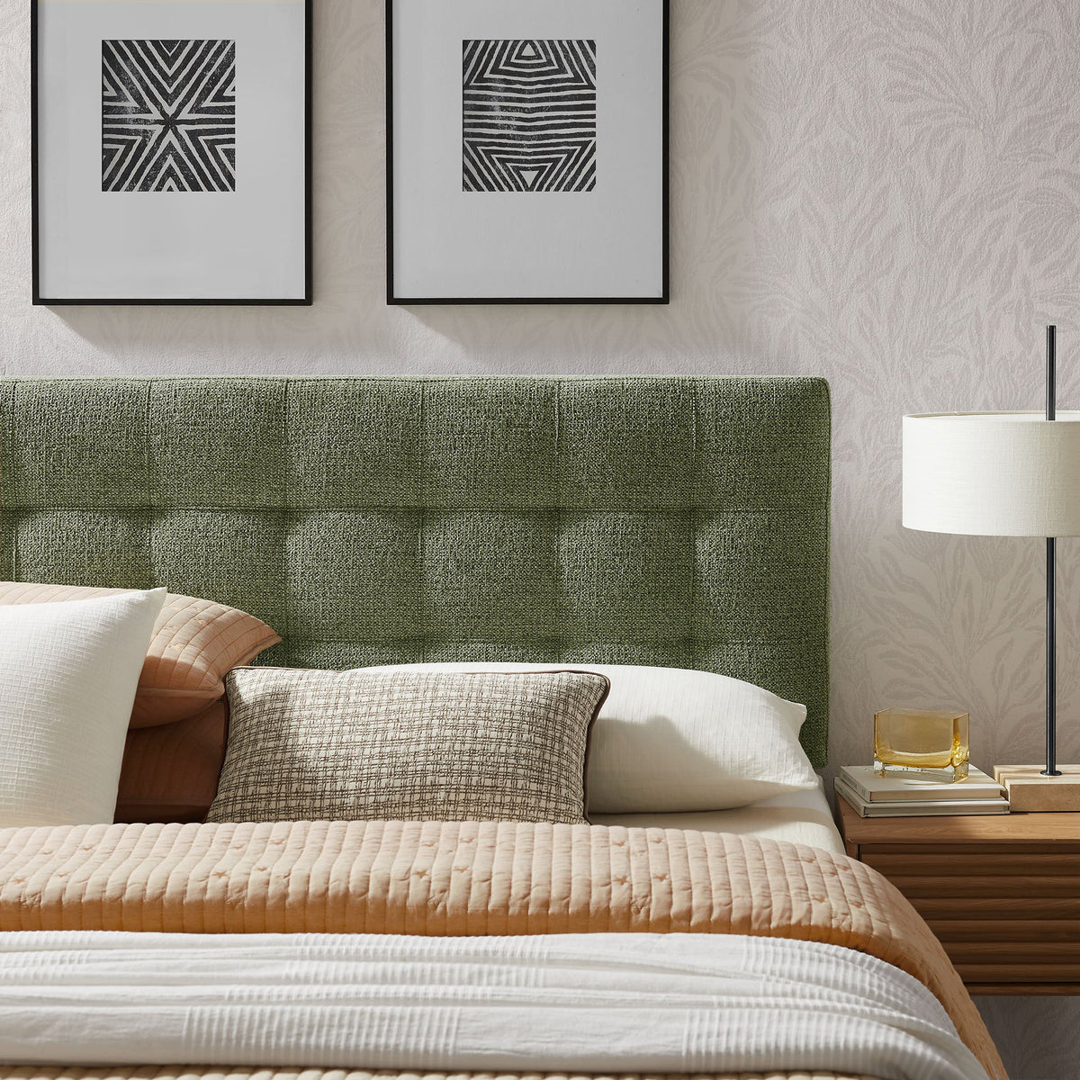Lily Upholstered Headboard in green textured fabric with black frame, two prints above bed on Tampa Home & Garden Store