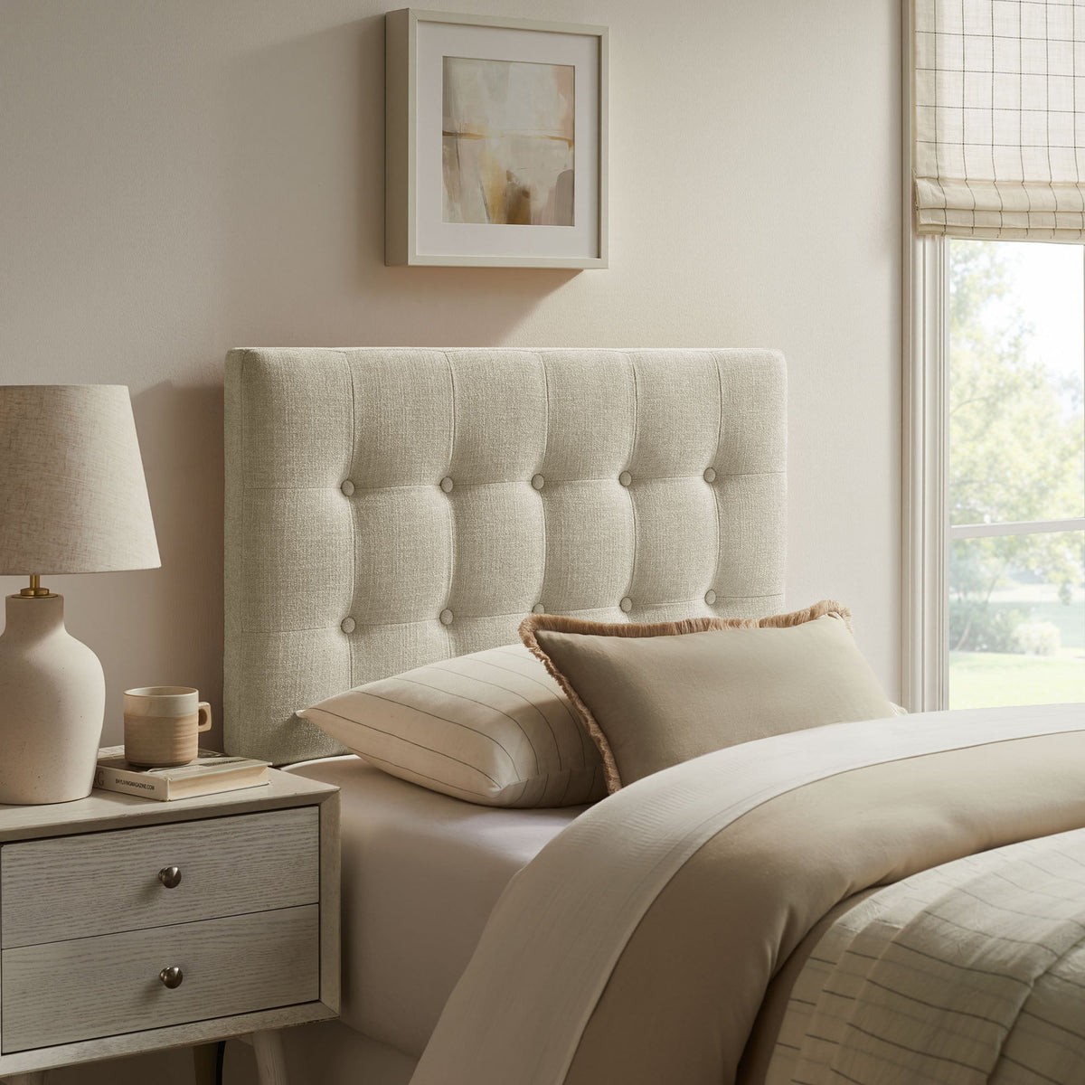 Emily Fabric Upholstered Headboard in light beige tufted fabric for bed in a neutral bedroom on Tampa Home & Garden Store