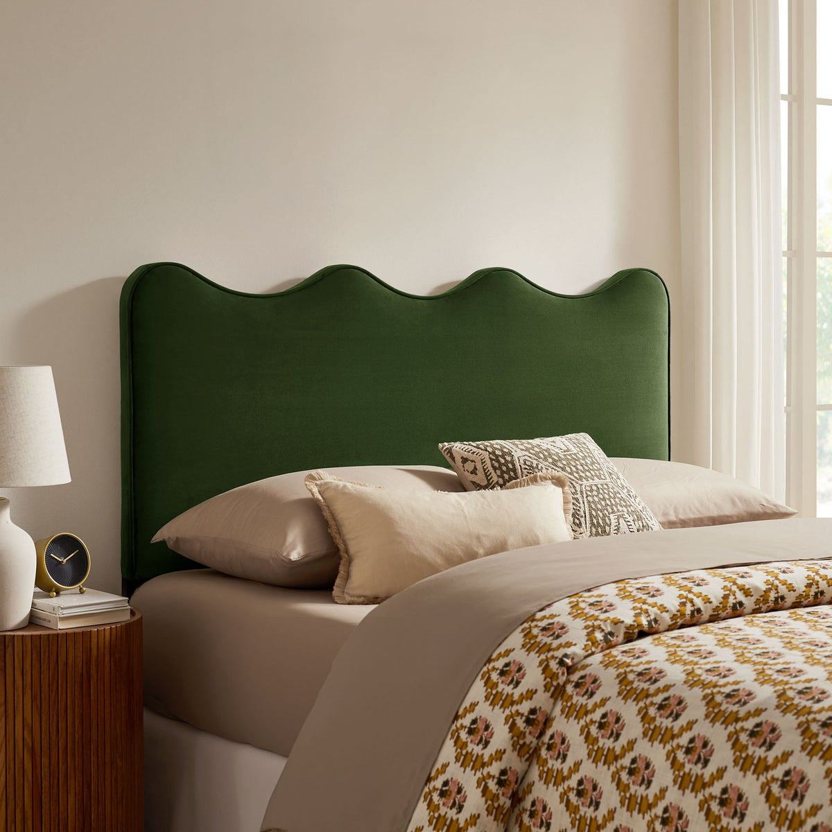 Athena stain-resistant performance velvet headboard in emerald green against beige wall on Tampa Home & Garden Store